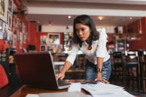 concerned woman at her laptop