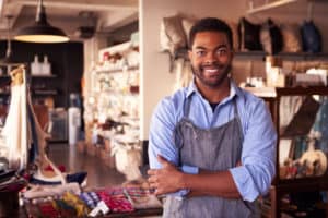 man in an apron smiling